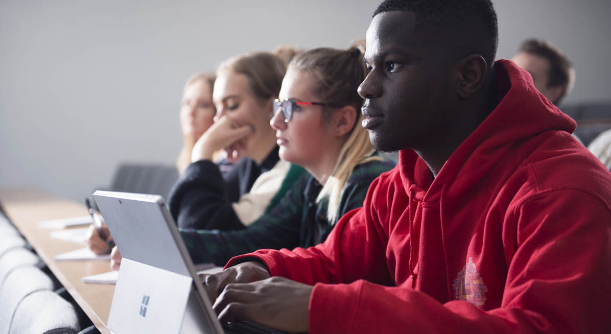 Students take down notes during a lecture